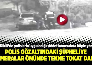 Polis gözaltındaki şüpheliye kameralar önünde tekme tokat daldı