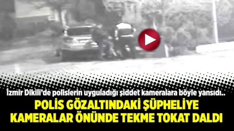 Polis gözaltındaki şüpheliye kameralar önünde tekme tokat daldı