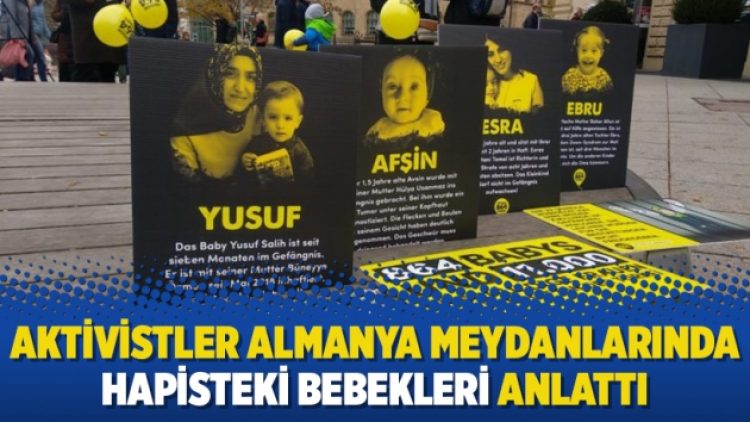 Gönüllü aktivistler Almanya meydanlarında hapisteki bebekleri anlattı