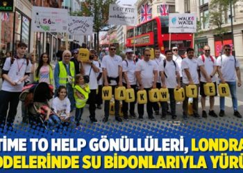 Time to Help gönüllüleri, Londra caddelerinde su bidonlarıyla yürüdü