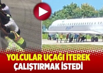 ​Yolcular uçağı iterek çalıştırmak istedi