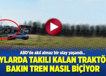 Raylarda takılı kalan traktörü bakın tren nasıl biçiyor