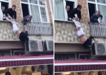 Elleri kelepçeli polisten kaçtı, pencerede asılı kaldı
