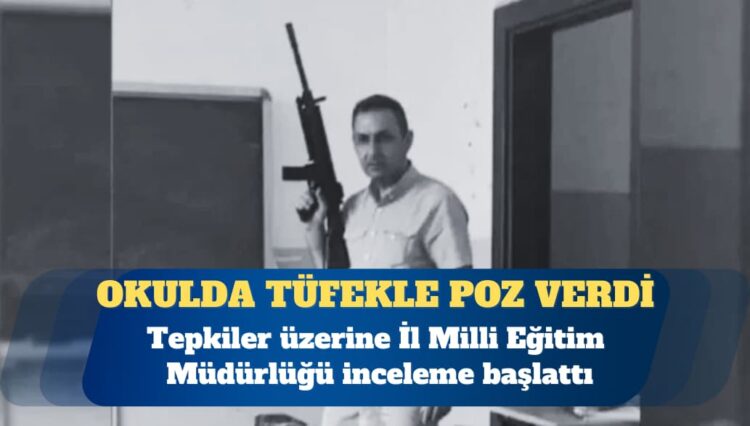 Okulda tüfekle poz verdi
